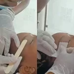 Application of sugar waxing on the brows and removal with a strip