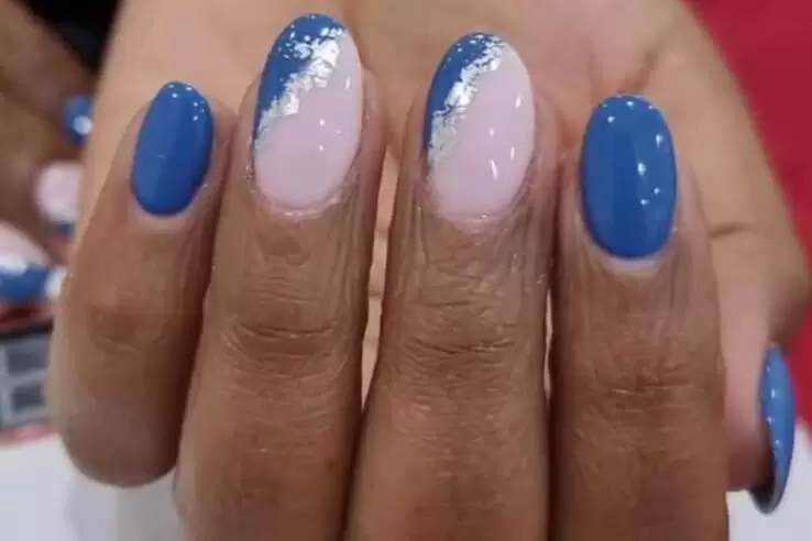 Decorated (blue and foil) long nails after dip powder acrylic manicure appointment at a client's home  with Viv's in-Houz spa's mobile nail technician in Nairobi